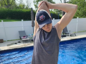 Lattisimus Dorsi stretch to correct Swimmer's Shoulder demonstrated by, competitive swimmer, Alex Aivalotis.